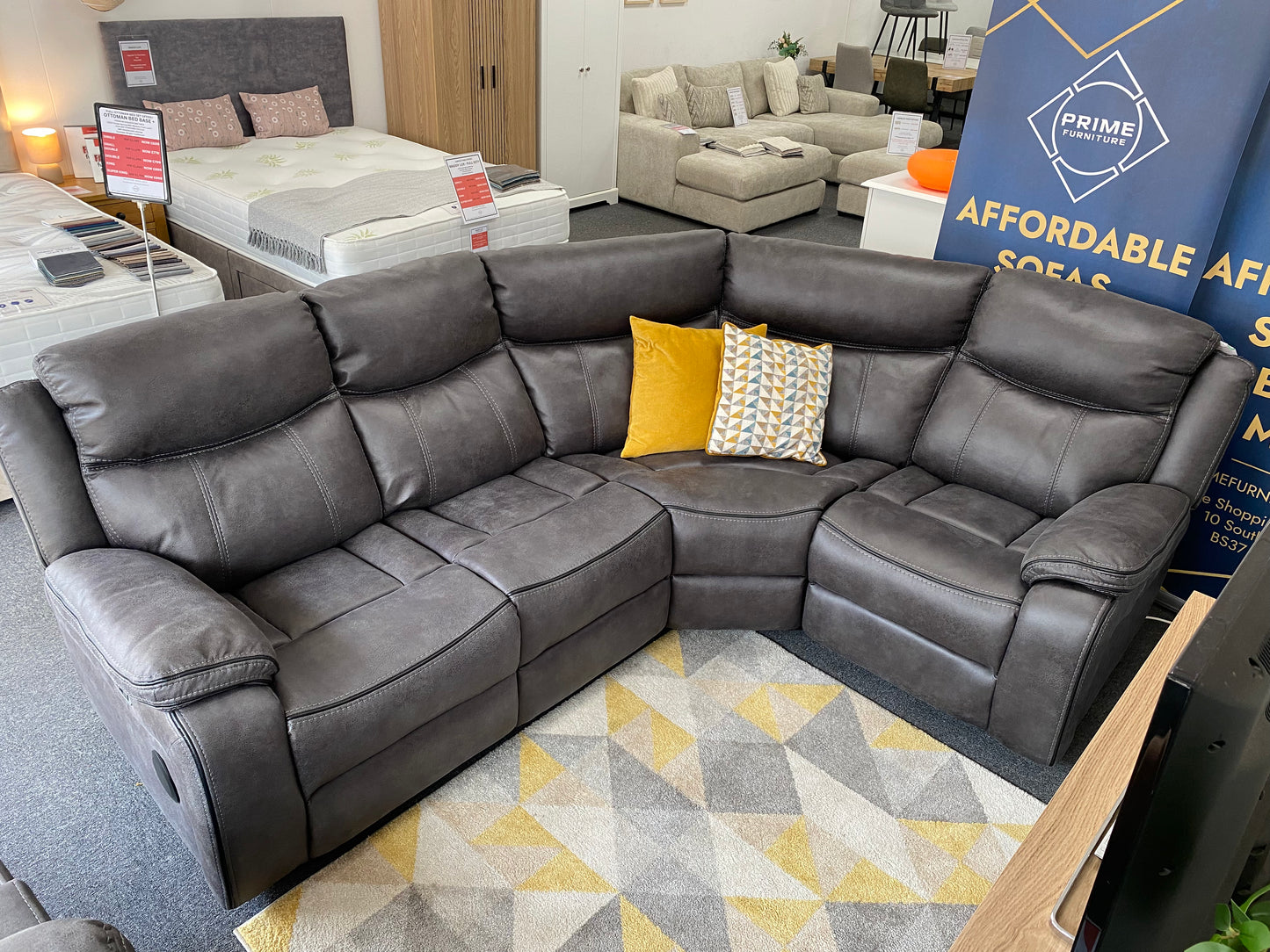 Lotus L-shaped corner power recliner sofa in grey faux suede, without console