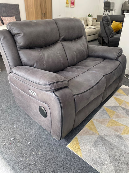 Lotus 2 seater power recliner sofa in grey, angled view showing side controls