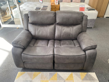 Lotus 2 seater power recliner sofa in grey, front view in showroom